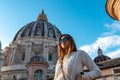 Rome - Tourist woman with close up view on the main dome of Saint Peter basilica in Vatican city, Rome, Europe Royalty Free Stock Photo