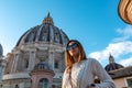 Rome - Tourist woman with close up view on the main dome of Saint Peter basilica in Vatican city, Rome, Europe Royalty Free Stock Photo