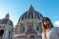 Rome - Tourist woman with close up view on the main dome of Saint Peter basilica in Vatican city, Rome, Europe Royalty Free Stock Photo