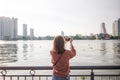 Tourist woman taking photo picture in bangkok, thailand. Royalty Free Stock Photo