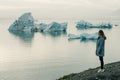 tourist woman on travel on Iceland by Jokulsarlon glacial lagoon on Iceland