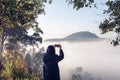 Tourist Woman Traveling and Taking Photos With Her Phone on Beautiful Tropical Jungle, Woman Journey Taking Nature Forest and Royalty Free Stock Photo