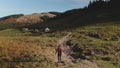 Tourist woman trekking rural country mountain road Royalty Free Stock Photo