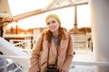 Woman coat with video camera standing near Ferris wheel in Paris Royalty Free Stock Photo