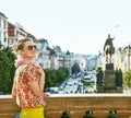 Tourist woman on Vaclavske namesti in Prague having excursion