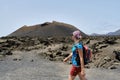 A Tourist woman visiting El Cuervo volcano, lanzarote, spain Royalty Free Stock Photo