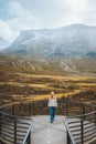 Tourist woman walking in Norway travel adventure outdoor mountains view active healthy lifestyle scandinavian nature autumn season