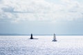 A tourist yacht sails under full sails across the calm Atlantic waters.