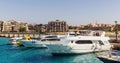 Tourist yachts and boats near the pier in Hurghada. Egypt.