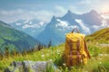 Tourist yellow backpack on background green grass nature in mountain, blurred panoramic landscape Royalty Free Stock Photo