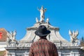 A tourist young man with a hat admiring a fortress gate entrance. A man admiring the 3rd Gate of the Alba-Carolina Fortress in Royalty Free Stock Photo