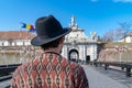 A tourist young man with a hat admiring a fortress gate entrance. A man admiring the 3rd Gate of the Alba-Carolina Fortress in Royalty Free Stock Photo