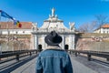 A tourist young man with a hat admiring a fortress gate entrance. A man admiring the 3rd Gate of the Alba-Carolina Fortress in Royalty Free Stock Photo