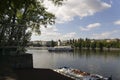 Touristic boat sailing on vltava river and historic buildings Royalty Free Stock Photo