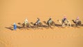 Touristic camel caravan in desert Royalty Free Stock Photo