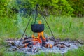 Touristic cauldron in a camp fire