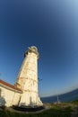 Touristic destination sea lighthouse and sunset Royalty Free Stock Photo