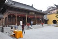 Shanghai, 2nd may: Touristic Guide stand from the Jade Buddha Temple courtyard in Shanghai