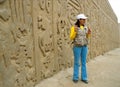 Touristic guide and wall carving