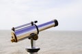 Touristic old seaside pay to view silver telescope stands