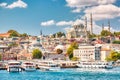 Touristic sightseeing ships in Golden Horn bay of Istanbul and view on Suleymaniye mosque with Sultanahmet district against blue Royalty Free Stock Photo