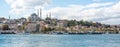 Touristic sightseeing ships in Golden Horn bay of Istanbul and view on Suleymaniye mosque with Sultanahmet district against blue Royalty Free Stock Photo