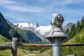 Touristic telescope in alpine valley Royalty Free Stock Photo