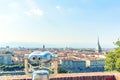 Touristic telescope look at the city center of Torino Turin, Italy, close up metal binoculars on background viewpoint overlookin