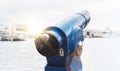 Touristic telescope look at city and sea with sunset view of Barcelona Spain, close up old blue binoculars on background viewpoint Royalty Free Stock Photo