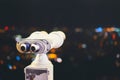 Touristic telescope look at city with view of Barcelona Spain, close up old metal binoculars on background viewpoint, hipster coin