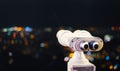 Touristic telescope look at city with view of Barcelona Spain, close up old metal binoculars on background viewpoint