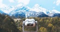 Touristic telescope look at the city with view snow mountains, metal binocular on background viewpoint observe vision, closeup Royalty Free Stock Photo