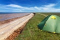 Touristic tent in astrakhan steppe under beautiful sky. Panorama of nature near salt lake Baskunchak