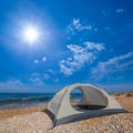 Touristic tent stay on sandy sea beach at sunny day Royalty Free Stock Photo