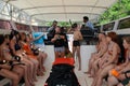 Koh Phi Phi Ley Island, Thailand - JULY 15, 2018: Unidentified tourists aboard a boat are being instructed before snorkeling