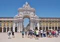 Tourists admire the Arco de Augusta in Lisbon - Portugal