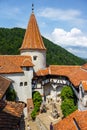 Tourists admire the Bran Castle also know as Dracula Castle near Brasov, Romania. Royalty Free Stock Photo