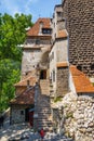 Tourists admire the Bran Castle also know as Dracula Castle near Brasov, Romania. Royalty Free Stock Photo