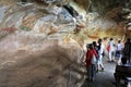 Tourists admire the cave frescoes at Sigiriya Rock Fortress.