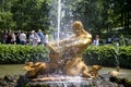 Tourists admire Greenhouse fountain with a sculpture of Triton,