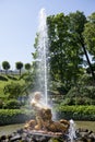 Tourists admire Greenhouse fountain with a sculpture of Triton,