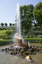 Tourists admire Greenhouse fountain with a sculpture of Triton,