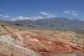 Tourists admire the red mountains of the Martian landscapes of Chagan-Uzun in Altai.