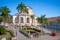 Tourists admire typical architecture in Trinidad, Cuba.