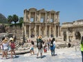 Tourists admiring the beautiful view over Celsus Library at Ephesus Ancient city, near Selcuk, Izmir province in Turkey Royalty Free Stock Photo