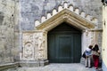 Tourists admiring details of San Fedele medieval church, Como