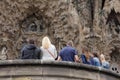Tourists admiring the Sagrada Familia in Barcelona, Spain