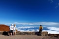 Tourists admiring stunning landscape view of Haleakala volcano area from the summit. Maui, Hawaii,