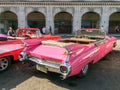 Tourists admiring vintage american classic cars parked in Havana, Cuba Royalty Free Stock Photo