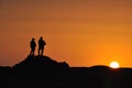 Tourists against sunset Royalty Free Stock Photo